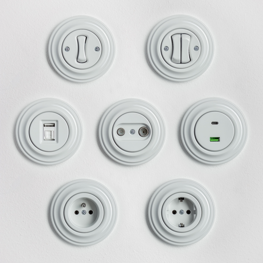 Kliklap – retroknapp med ram i vit keramik